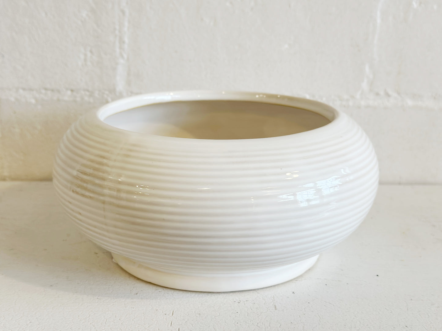 Raised white ceramic bowl