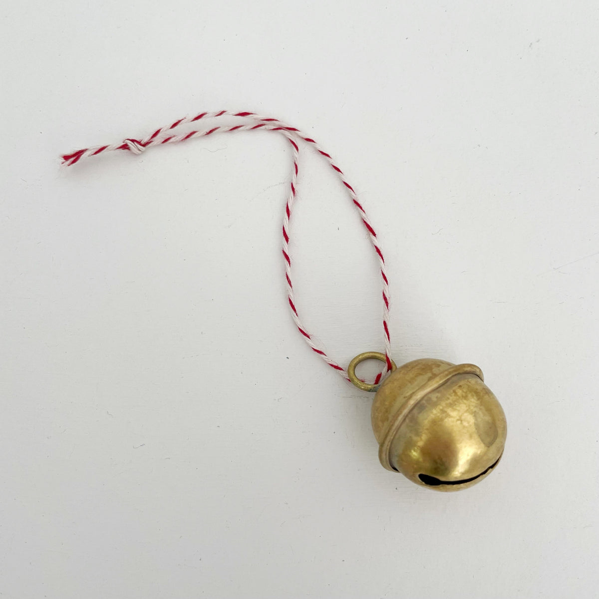 1 1/4" brass sleigh bell Christmas ornament : Red/Wht Bakers Twine