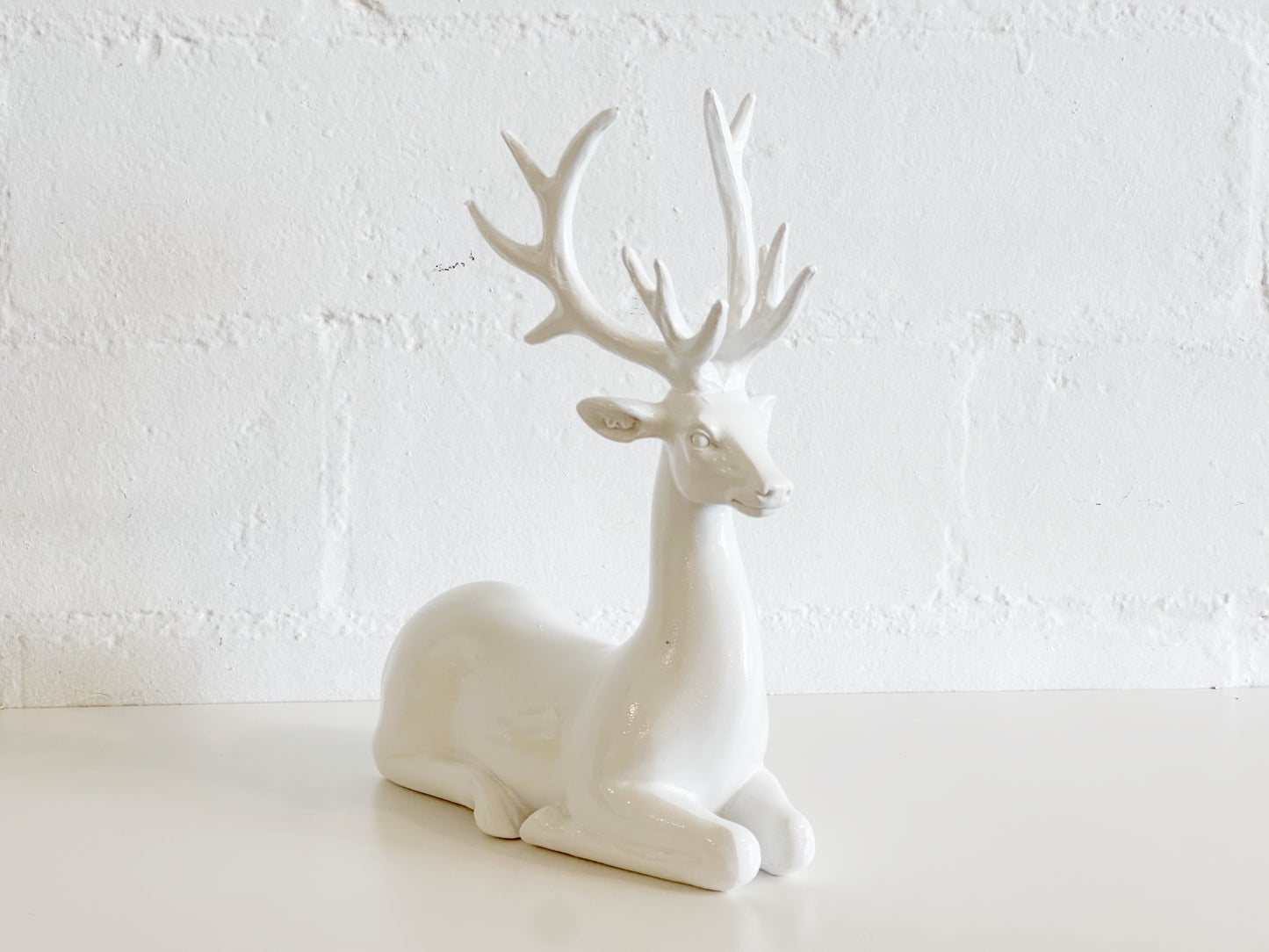 White Sitting Deer
