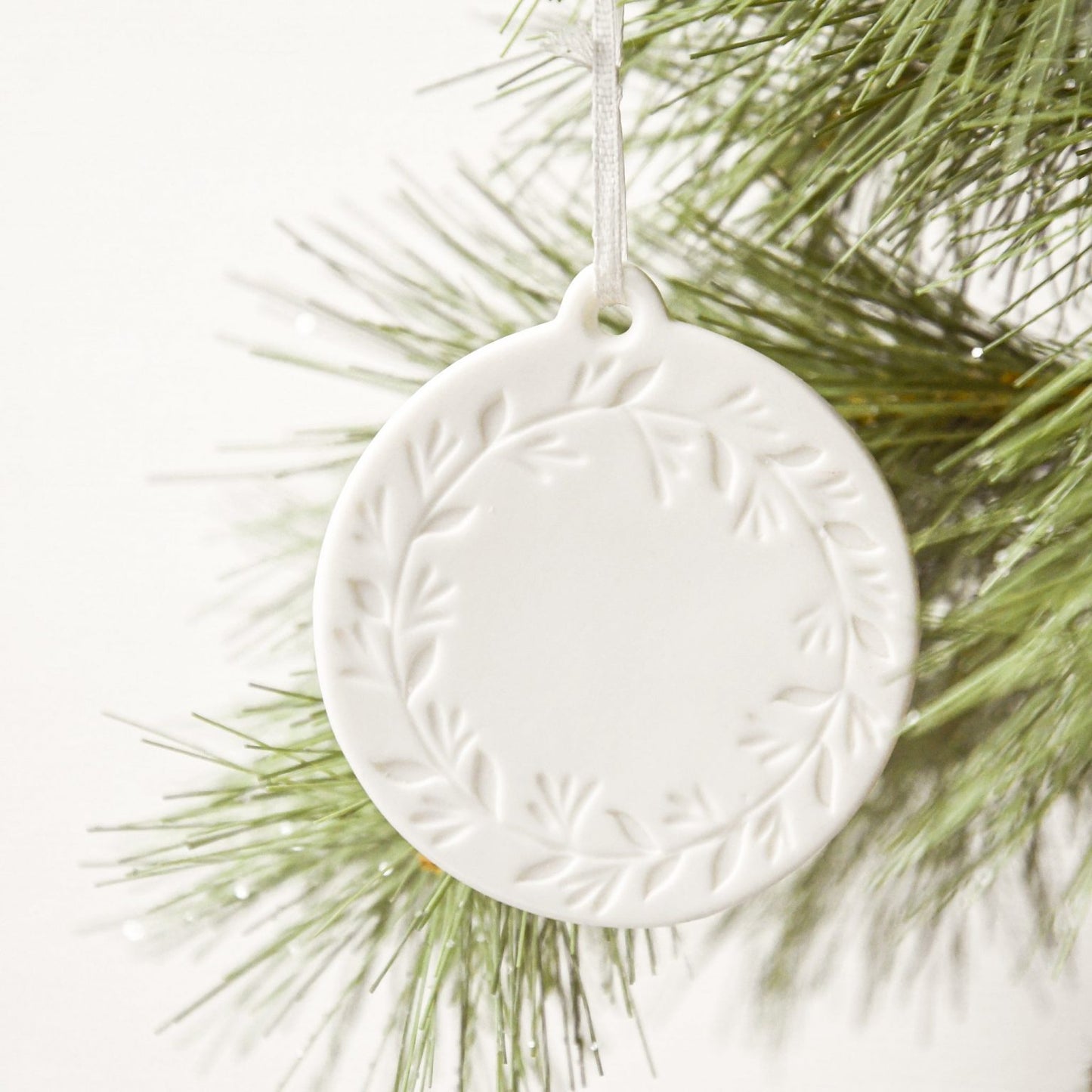 ROUND STONEWARE ORNAMENT