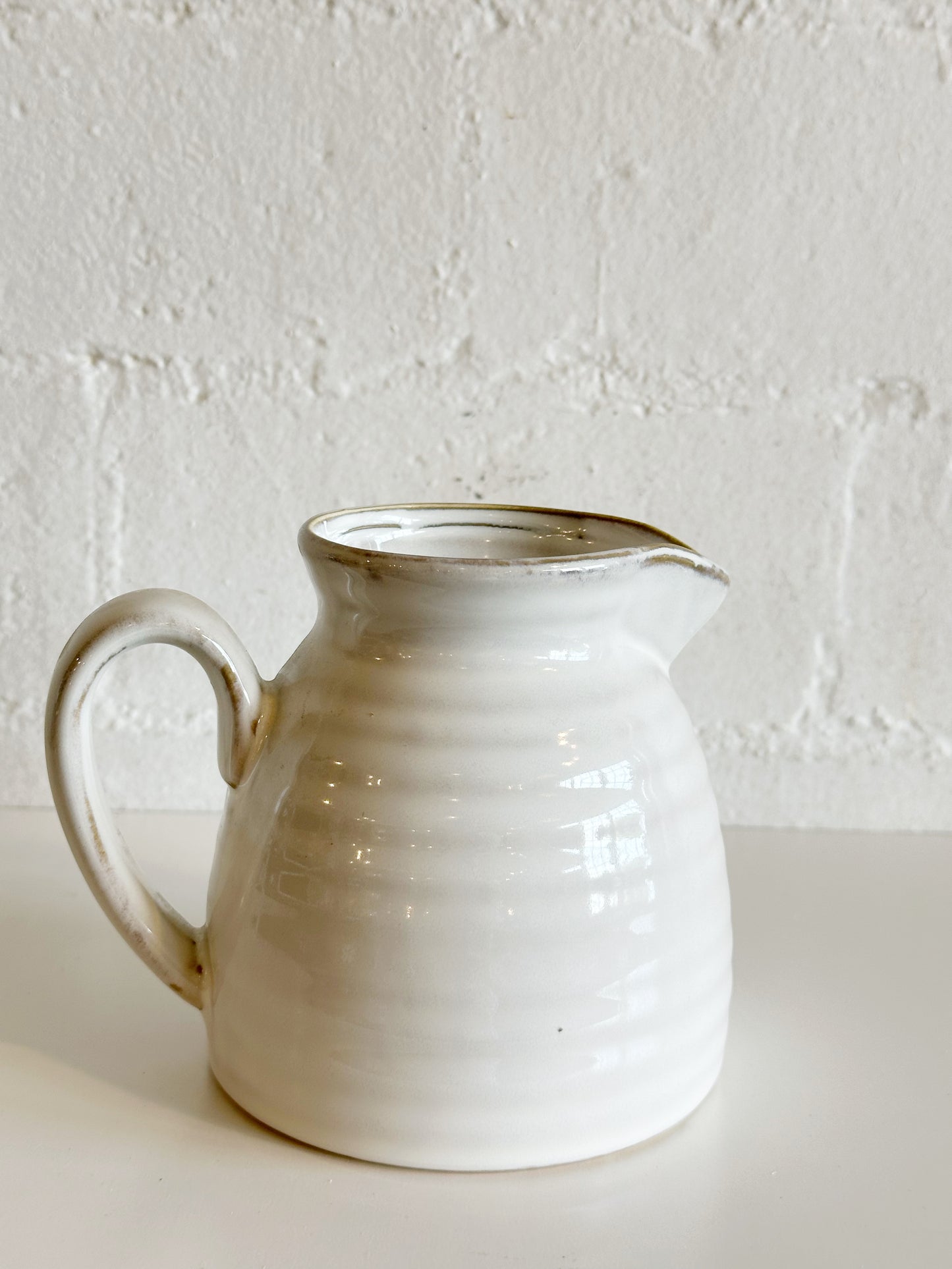 WHITE CERAMIC PITCHER